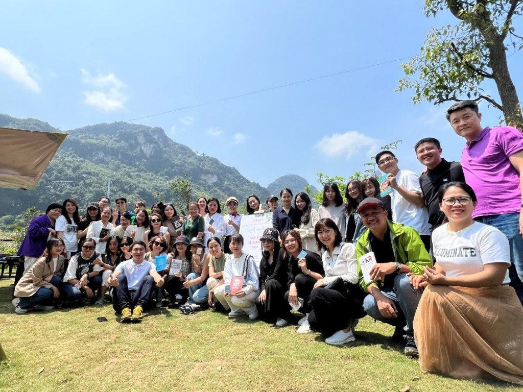 A group of people posing for a photo

Description automatically generated